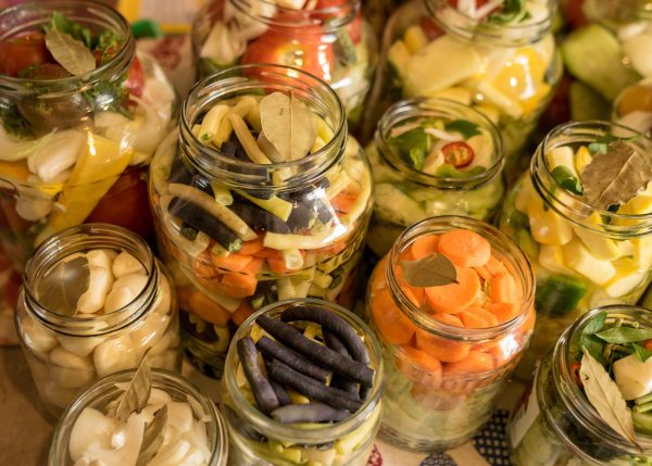 glass jars with various vegetables, salting various vegetables i
